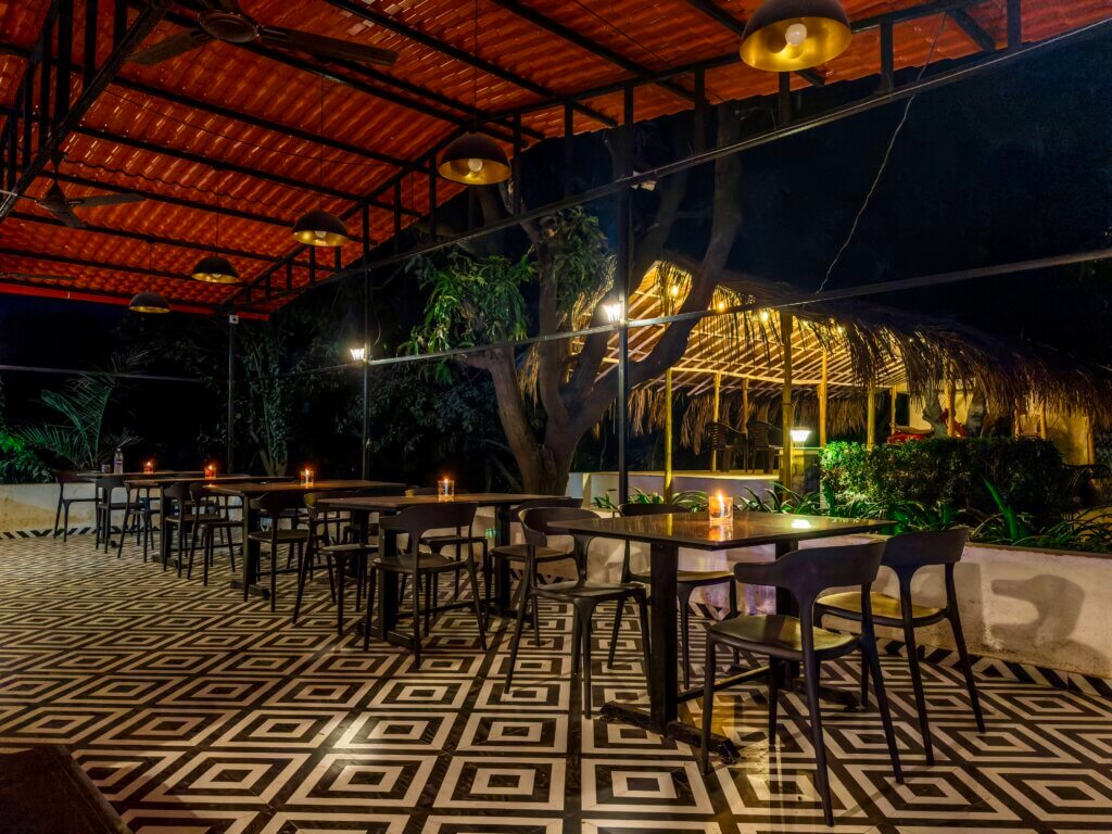 The open-sided in-house restaurant at NB Nature Stay in the evening