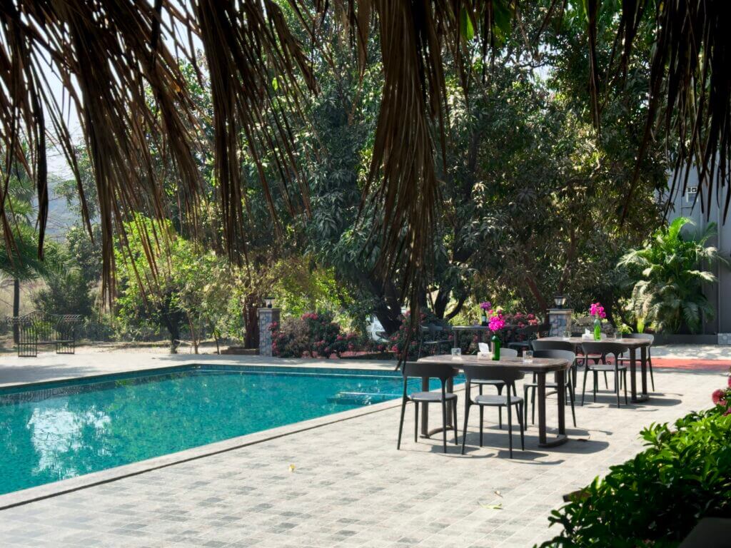 Swimming pool and shaded seating at NB Nature Stay