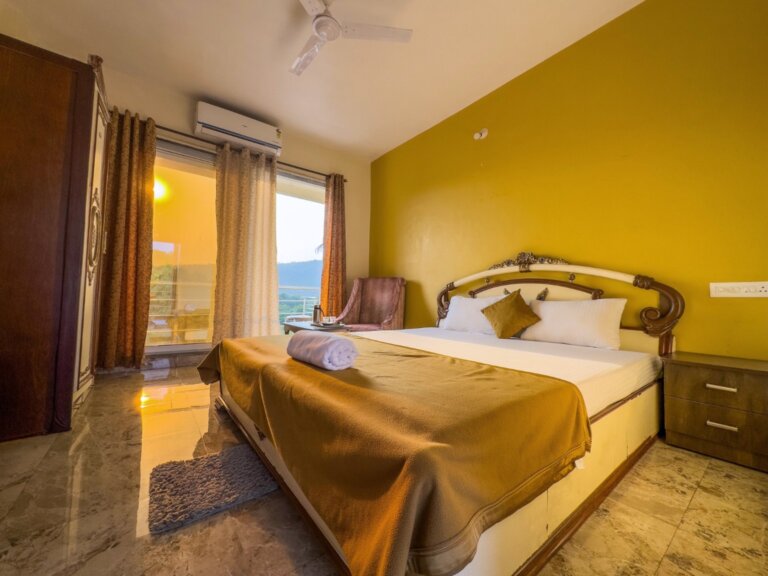 Golden-accent bedroom at NB Nature Stay