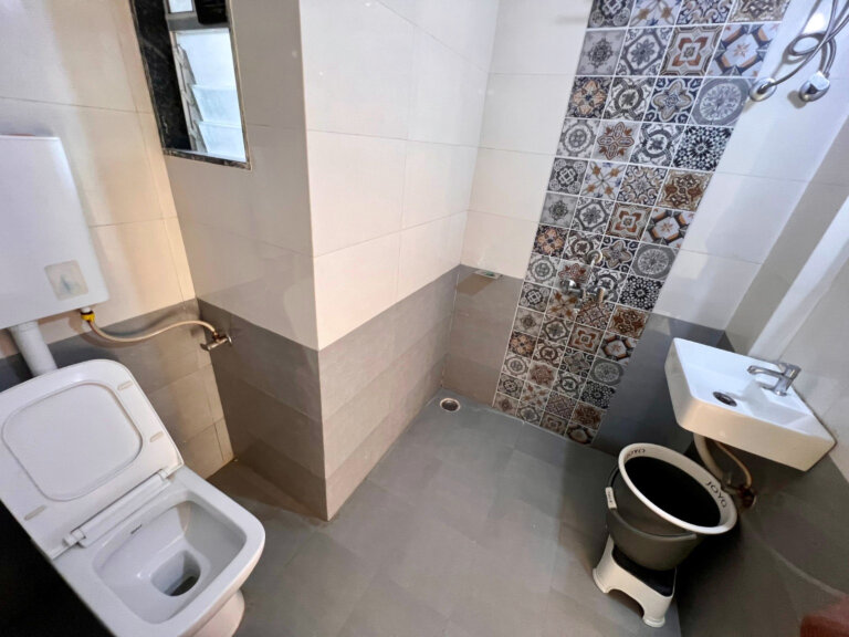 Bathroom layout with shower and washbasin at NB Nature Stay