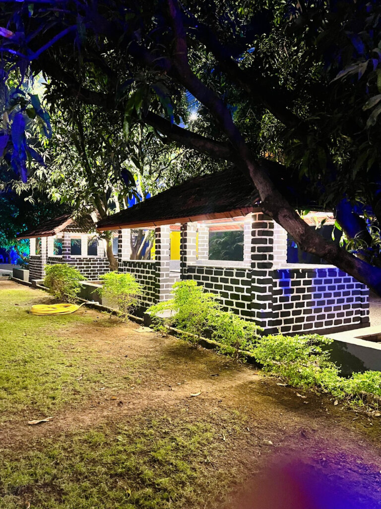 Gazebos beneath the trees at night at NB Nature Stay